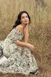 a lady wears a silk floral printed maxi dress